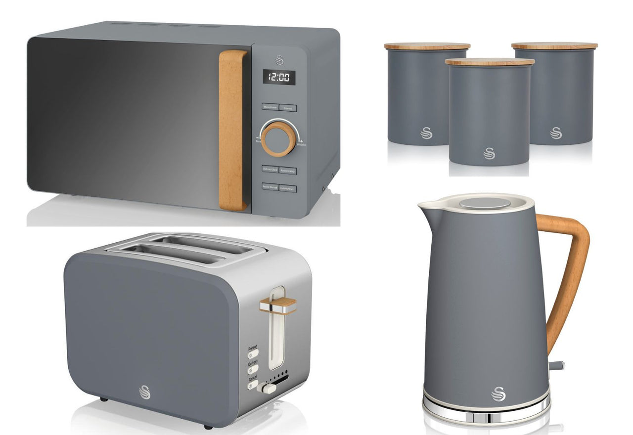 A set of Swan Nordic kitchen appliances in grey color, including a 1.7L jug kettle, a 2 slice toaster, an 800W 20L microwave, and matching canisters.