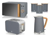 A set of Swan Nordic kitchen appliances in grey color, including a 1.7L jug kettle, a 2 slice toaster, an 800W 20L microwave, and matching canisters.